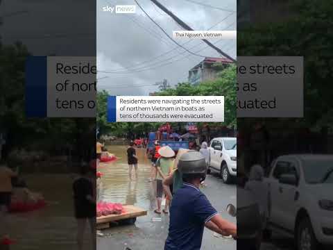 Vietnam residents paddle through streets