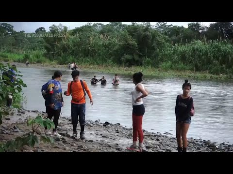 Migrants pass through once impenetrable Darien jungle in Panama