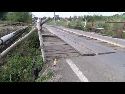 FARMERS AND RESIDENTS OF LIGHT BOURNE ROAD IN GASPARILLO PITCHED IN AND REBUILT A DILAPIDATED BRIDGE