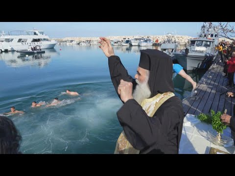 Cypriots participate in the Blessing of the Waters to celebrate Epiphany Day | AFP