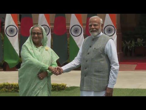 Prime ministers of India and Bangladesh pose for media ahead of talks in New Delhi