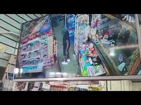 A SECURITY GUARD, COULD HAVE LOST HIS LIFE WHEN TWO BANDITS WERE ROBBING A CHINESE SUPERMARKET.