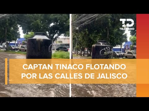 Captan tinaco flotando en avenida inundada de Guadalajara