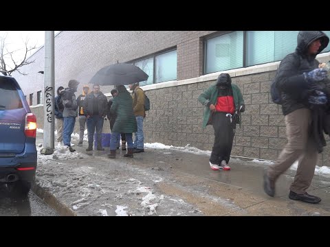 Migrants warm up inside buses during Chicago winter storm