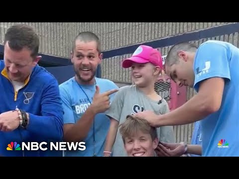 High school football team helping a little girl through a tough time