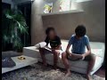 boy slaps his brother with the ipad