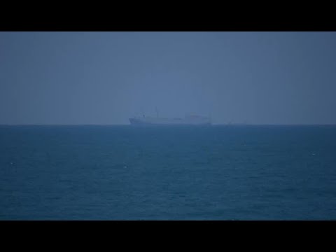 US Navy ship and other vessels visible off Gaza's coast amid efforts to boost aid