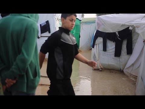 Displaced Gaza residents sheltering in tents face heavy rainfall overnight