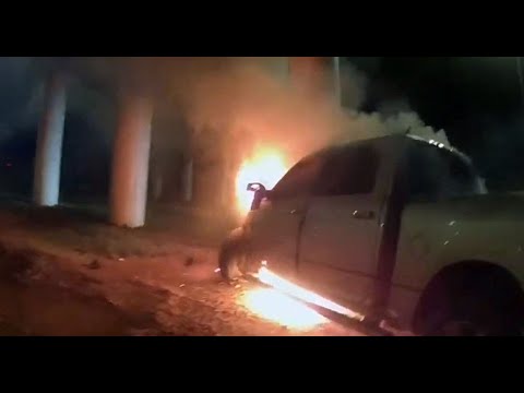 Dramatic video shows officers save driver from burning truck after brakes fail