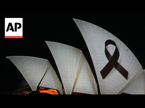 Sydney Opera House sails lit with black ribbon to pay tribute to stabbing victims