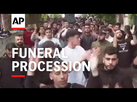 Funeral procession for Palestinian killed in attack on Palestinian village in the West Bank