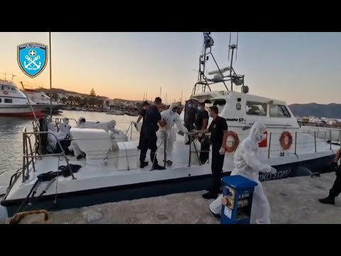 Greece: Migrants rescued after boat sinks return to land | AFP