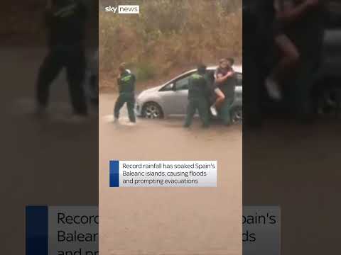 Family rescued from car in flood-hit Spain