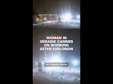 Woman in Ukraine carries on working after explosion