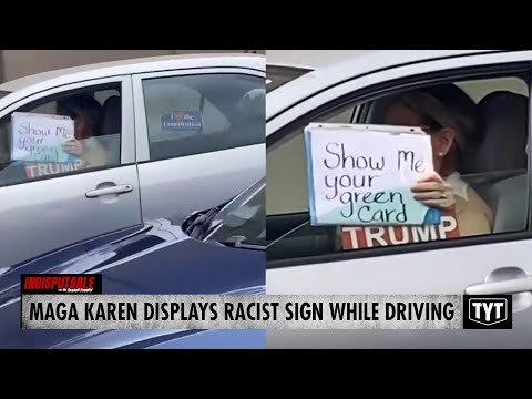 WATCH: Trump-Loving Karen Flaunts Racist Sign While Driving