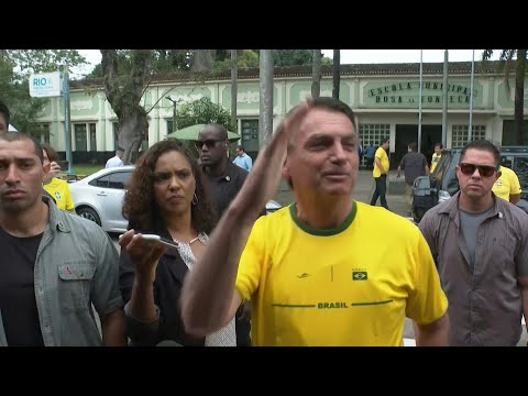 Brazil incumbent Bolsonaro arrives to cast vote in election | AFP
