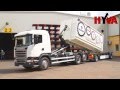 Scania G410 hakowiec podczas przeadunku kontenera 