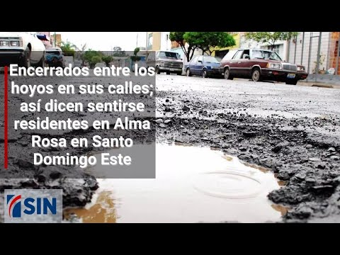 Encerrados entre los hoyos en sus calles, alegan los residentes en Alma Rosa en Santo Domingo Este