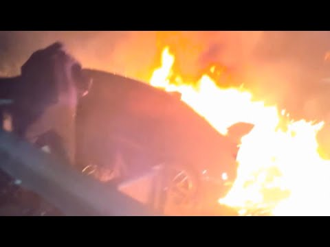 Heart-Stopping Video Captures Bystanders Pulling Man Out of Burning Car