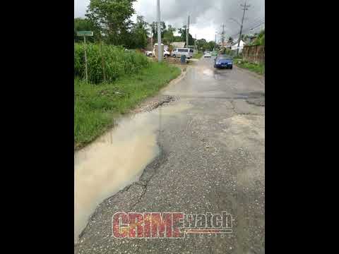 RESIDENTS AT CHIN CHIN ROAD, LAS LOMAS # 1 ARE UNHAPPY AT THE DILAPIDATED CONDITIONS OF THE ROADS