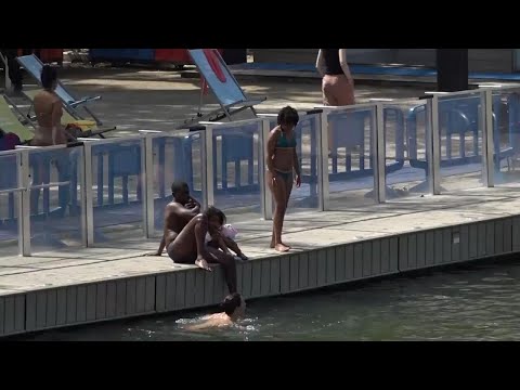 Olympic visitors in Paris try to keep cool, with France under heat wave warning