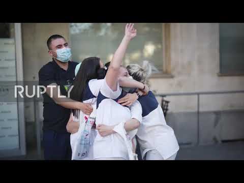 Spain: Health workers and locals applaud each other for helping fight coronavirus spread