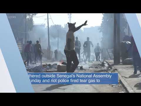 VOA60 Africa - Senegal police used tear gas against protesters gathering against election delay