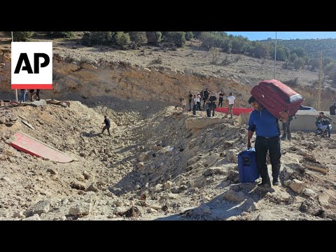 Israeli airstrike creates crater blocking highway at key crossing between Lebanon and Syria