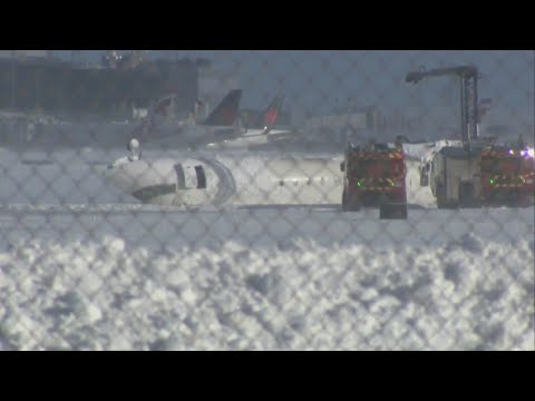 Child among 17 hurt after Delta flight flips while landing at Toronto airport