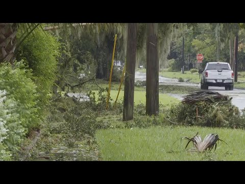 Residents in Sanford, Florida survey damage after Hurricane Milton