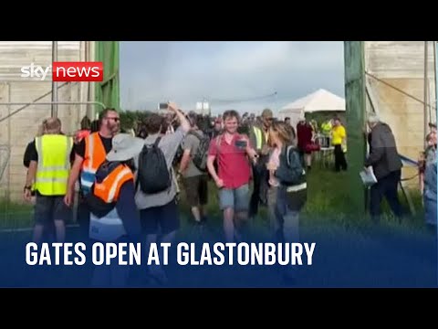 Glastonbury 2023: Festival goers pour though the gates at Worthy Farm