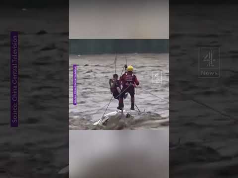 Man rescued after trapped in car in flooded river