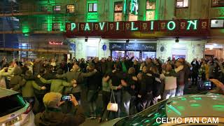 Celtic Fans Doing the Huddle on Glasgow Street