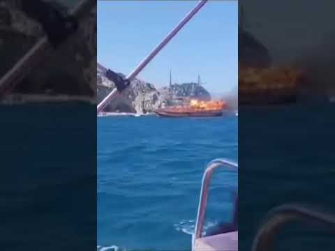 Tourists evacuated after wooden boat catches fire off coast
