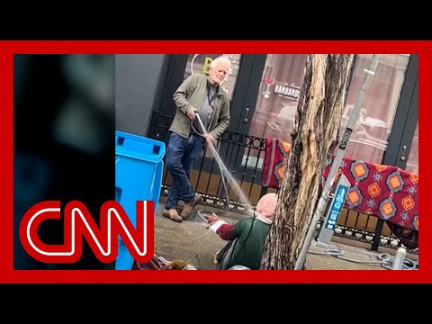 Viral video of man spraying homeless woman sparks outrage