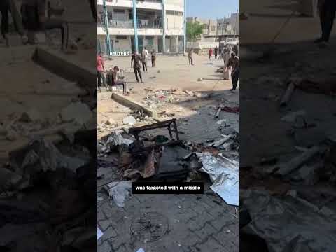 Child flees Israeli strike on Gaza refugee camp