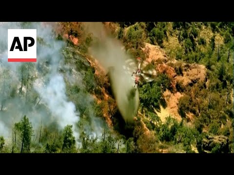 Aerial footage shows crew combatting California wildfire