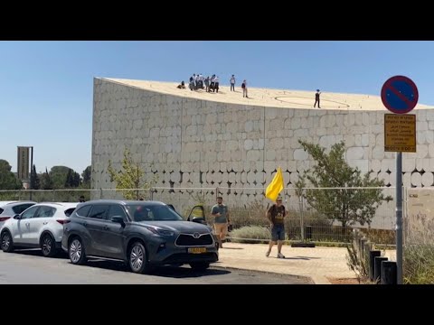Anti-Gaza war protesters climb onto national library's roof in Jerusalem | AFP