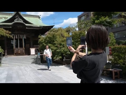 In secular Japan, what draws so many to temples and shrines?