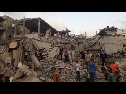 Gazans search through the rubble following Israeli strike on Deir El-Balah | AFP