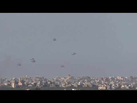 Aid airdropped on northern Gaza, seen from Israel | AFP