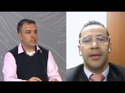 Jorge Coronel, economista, y docente y Andrés Úsuga, decano facultad de derecho U. Santo Tomás