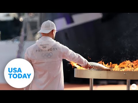 Olympic torch in France ahead of 2024 Paris Olympics | USA TODAY