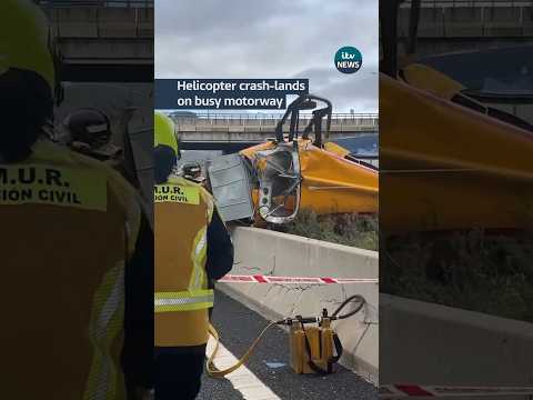 Helicopter crash-lands on busy motorway #itvnews #helicopter #madrid #spain