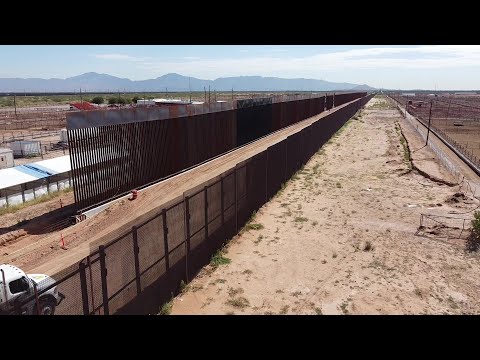 Part of US-Mexico border wall painted in black at Trump's request | AFP