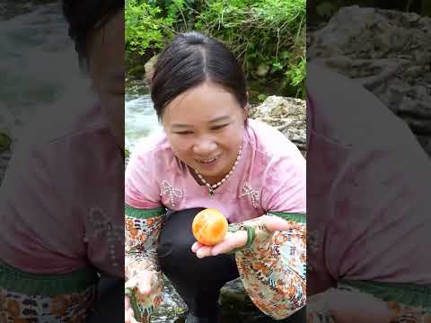 Girl collecting oversized pearls in the wilderness
