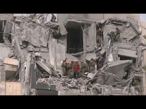 Israel rescuers search rubble of building hit by deadly Iranian strike | AFP
