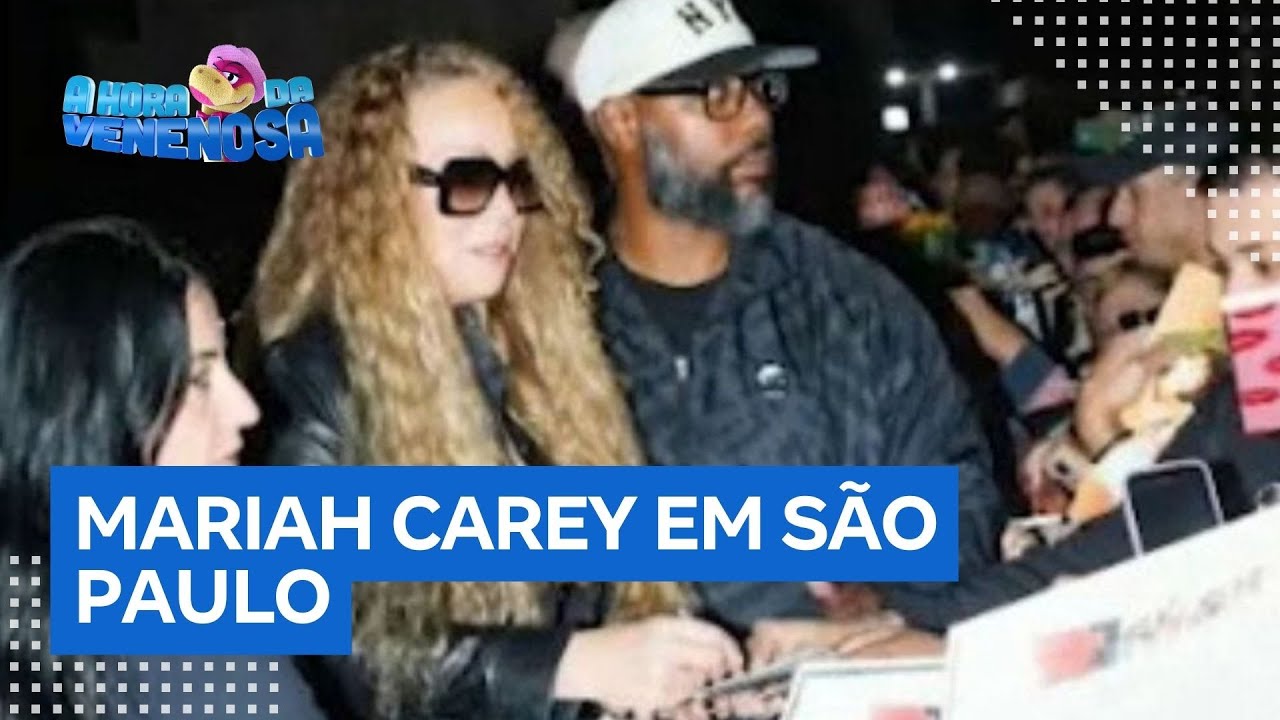 Mariah Carey aparece de óculos escuros e dá autógrafos para fãs em hotel de SP