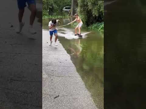 Flooded streets couldn't stop these kids in Louisiana from having fun.
