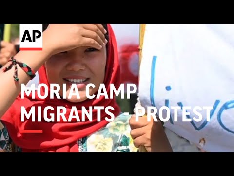 Lesbos migrants march against new camp facility
